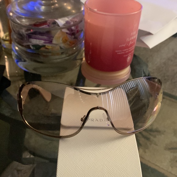 Prada Shades and they have some scratches on them.Prada sell replacement.$60-80. - Picture 2 of 3